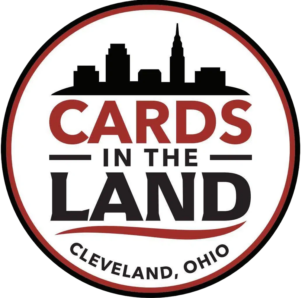 Logo for 'Cards in the Land' with a city skyline silhouette on a white background